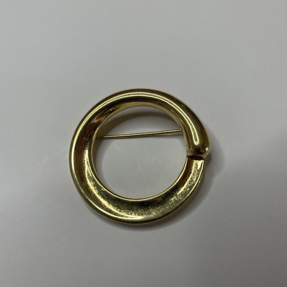 vintage monet circle brooch polished gold toned Signed pin